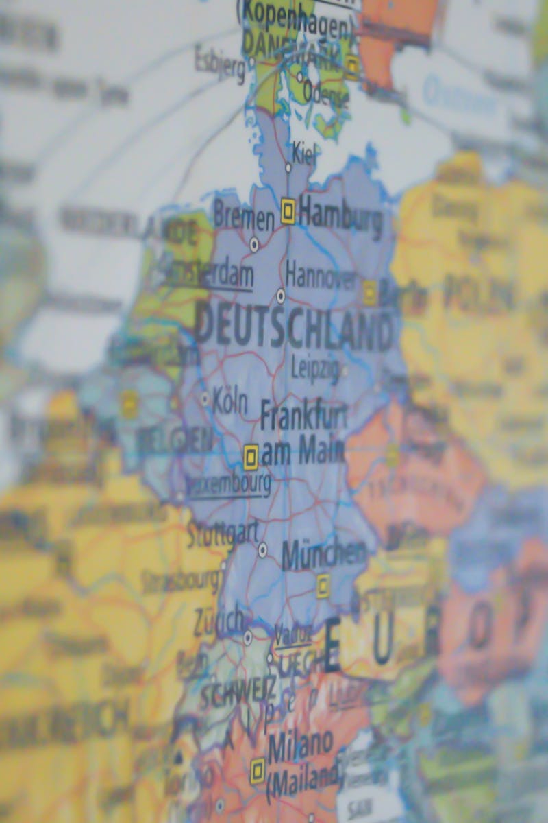 Close-up view of Germany on a colorful world map showing major cities.